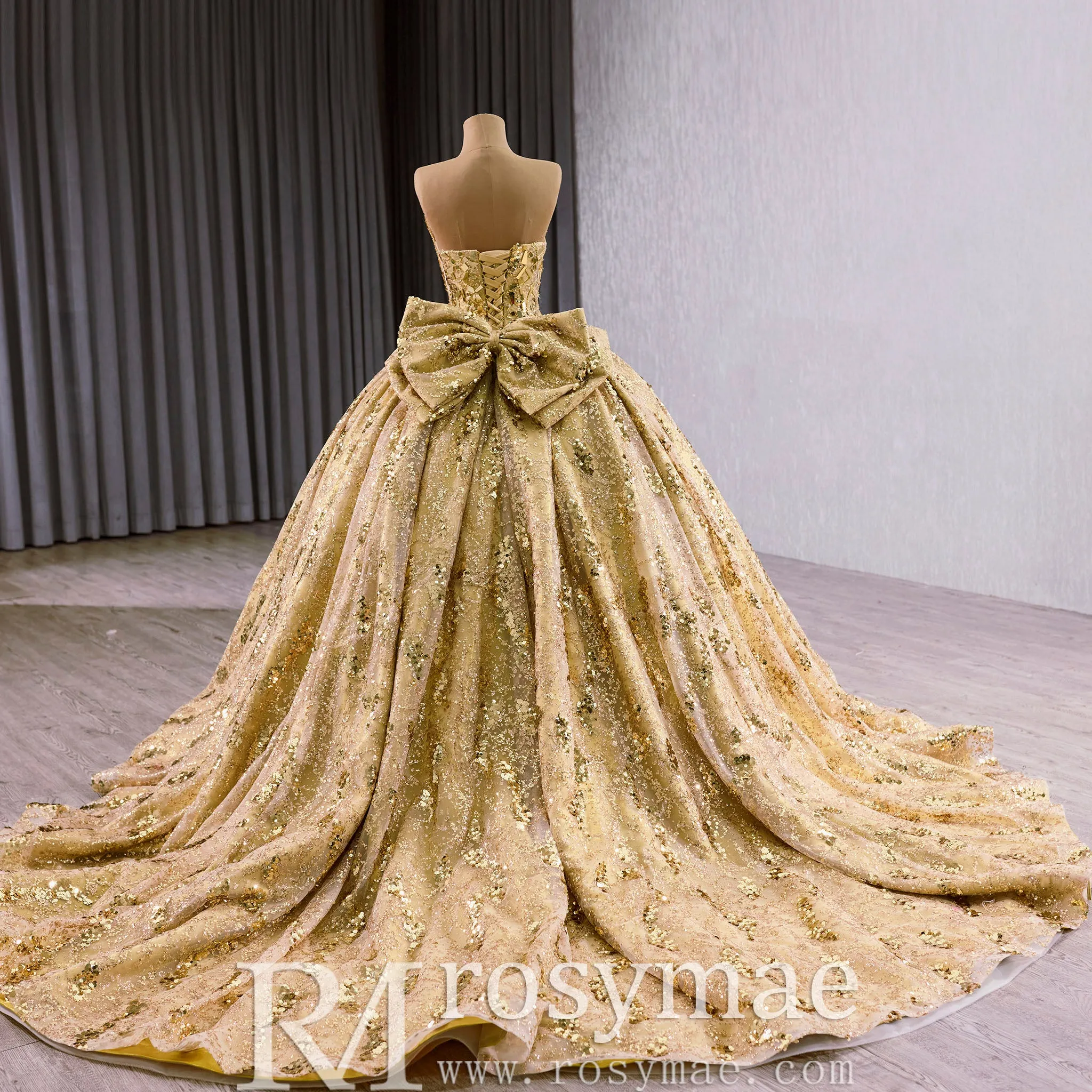 Strapless Gold Sparkly Princess Quinceañera Ball Gown with Bowknot